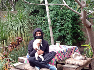 Artist Usman Saeed and Gaspar in his garden, Lahore