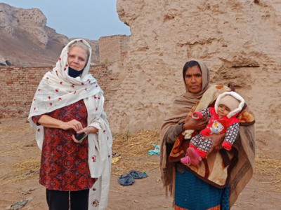 A photo with a friendly local woman and her adorable baby