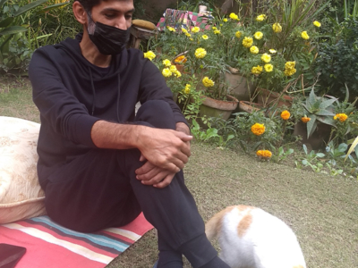 Artist Usman Saeed and Gaspar in his garden, Lahore